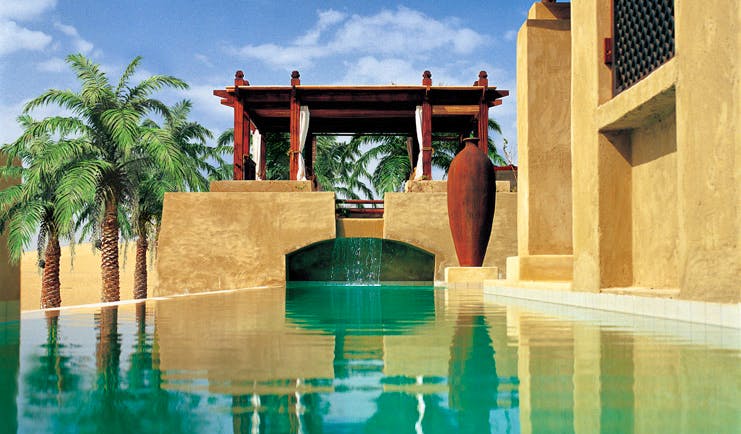 Bab Al Shams Desert Resort and Spa Dubai outdoor pool with cabana and palms