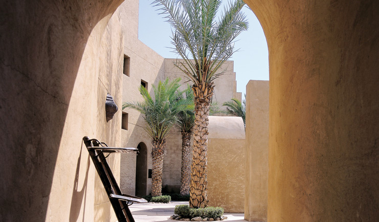 Bab Al Shams Desert Resort and Spa Dubai palms outdoor corridor and palm tree