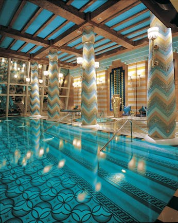 Burj Al Arab Dubai spa pool with mosaic columns and chairs