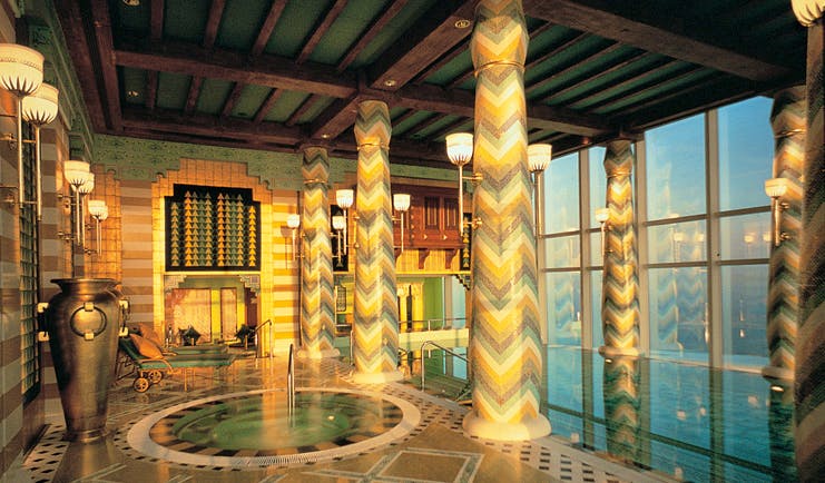 Burj Al Arab Dubai spa indoor pool with mosaic walls and floor jacuzzi and panoramic views