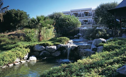 Palm Tree Court Jebel Ali Dubai gardens with stream and waterfall