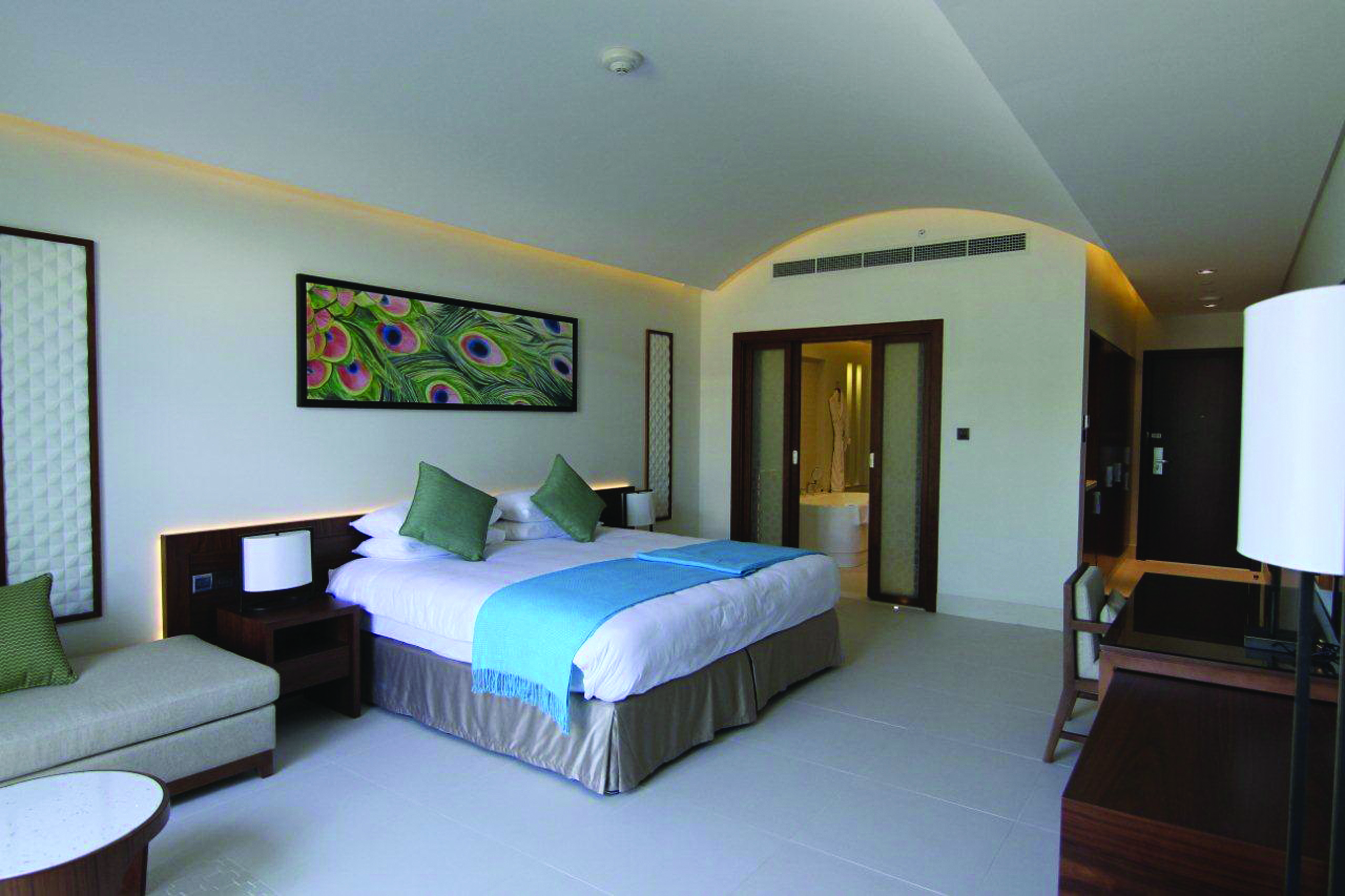 Palm Tree Court Jebel Ali Dubai junior suite bedroom picture of peacock feather and view to bathroom