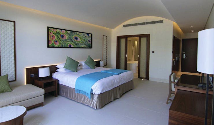 Palm Tree Court Jebel Ali Dubai junior suite bedroom picture of peacock feather and view to bathroom