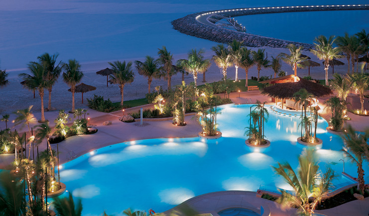 The Jumeirah Beach Hotel Dubai aerial view pool near the beach with palms