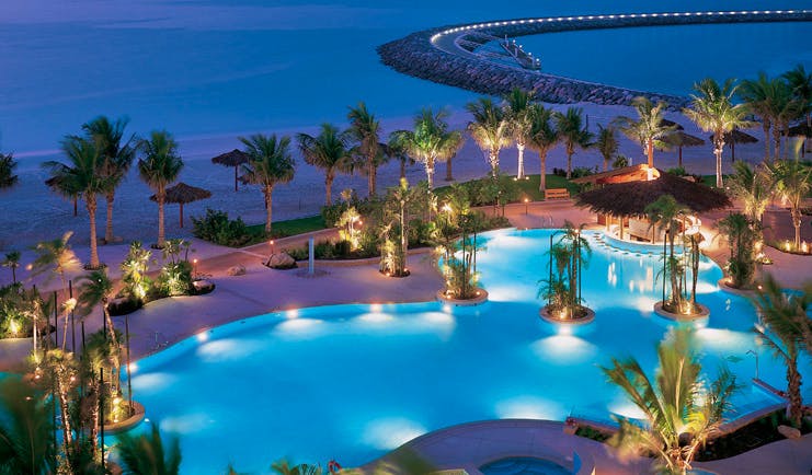 The Jumeirah Beach Hotel Dubai aerial view pool near the beach with palms