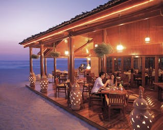 The Jumeirah Beach Hotel Dubai beach restaurant couple at decked restaurant on the beach
