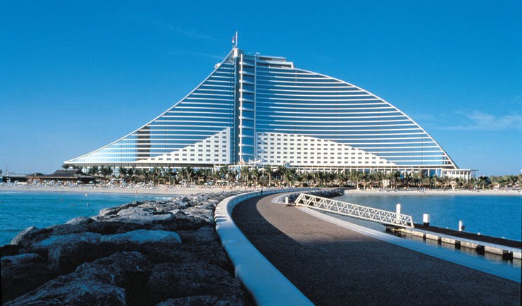 The Jumeirah Beach Hotel Dubai exterior bridged walkway to large glass fronted hotel and beach