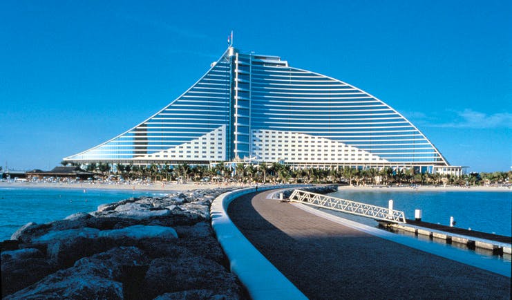 The Jumeirah Beach Hotel Dubai exterior bridged walkway to large glass fronted hotel and beach