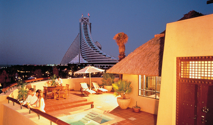 The Jumeirah Beach Hotel Dubai villa terrace balcony with pool seating area and view of hotel