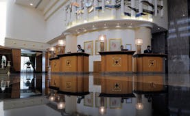 Le Royal Meridien Beach Resort and Spa Dubai lobby with several reception desks