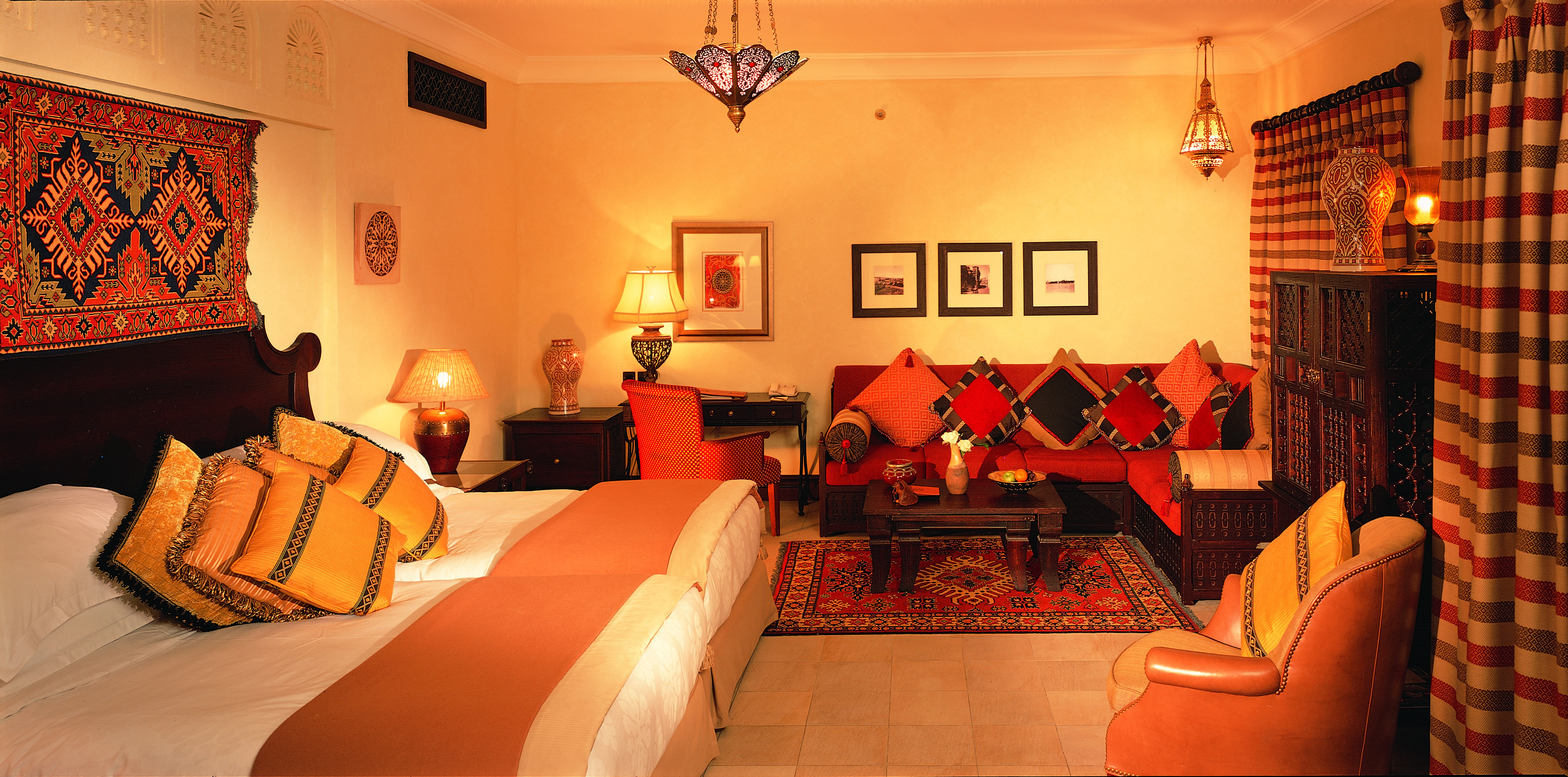 Madinat Jumeirah Dubai Dar Al Maysaf bedroom with sofa and armchair