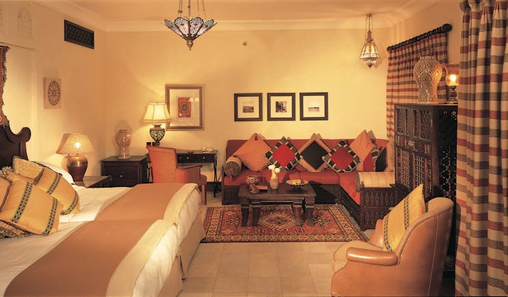 Madinat Jumeirah Dubai Dar Al Maysaf bedroom with sofa and armchair