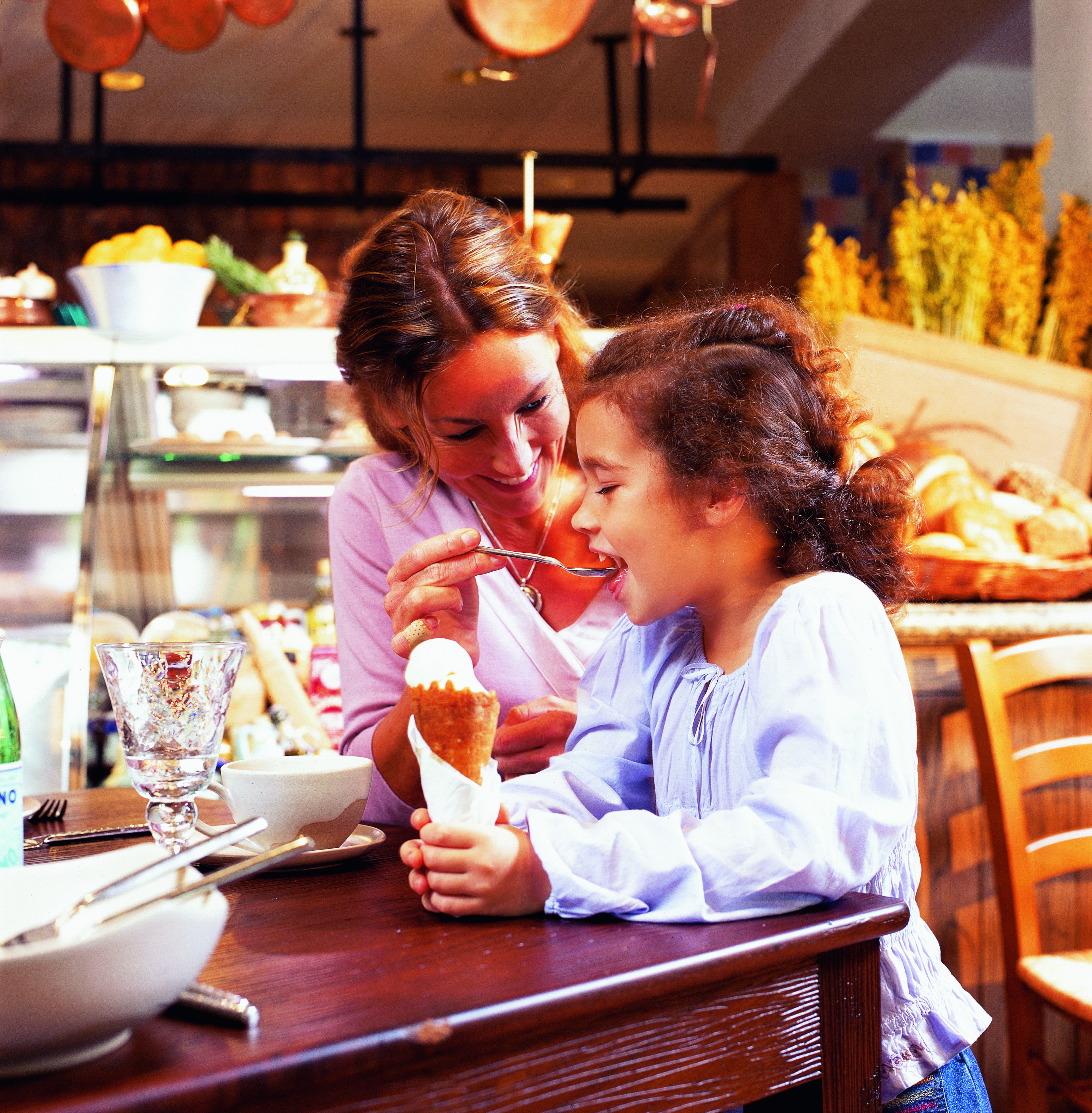 Madinat Jumeirah Dubai Trattoria Toscana woman feeding a child an ice cream