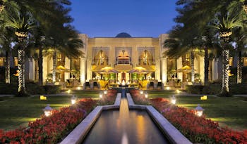 One and Only Royal Mirage Dubai exterior with fountain at night