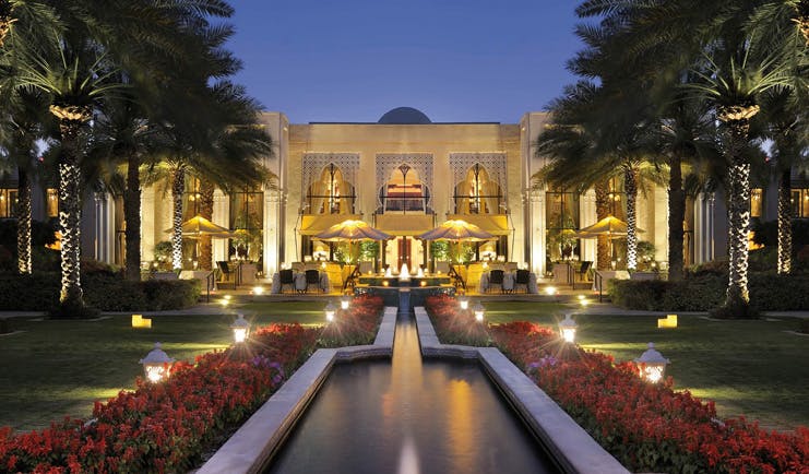 One and Only Royal Mirage Dubai exterior with fountain at night