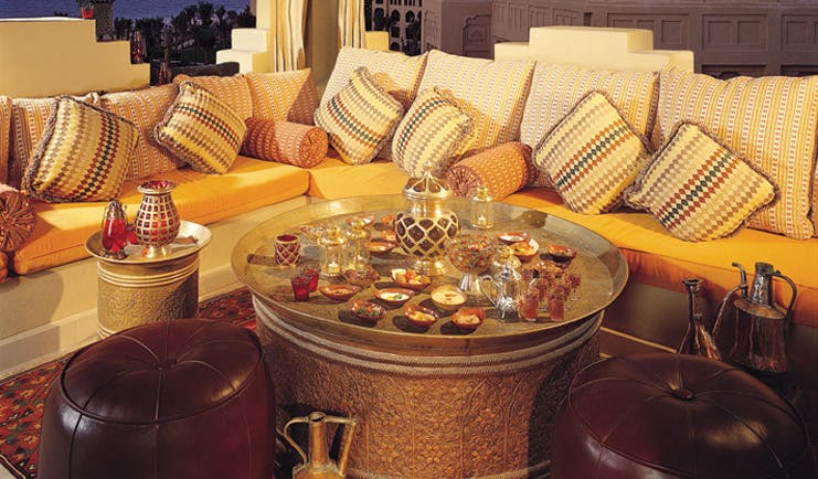 One and Only Royal Mirage Dubai lounge area with sofa tea and shisha pipe