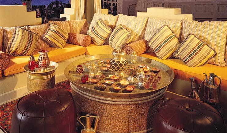 One and Only Royal Mirage Dubai lounge area with sofa tea and shisha pipe