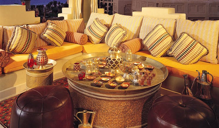 One and Only Royal Mirage Dubai lounge area with sofa tea and shisha pipe