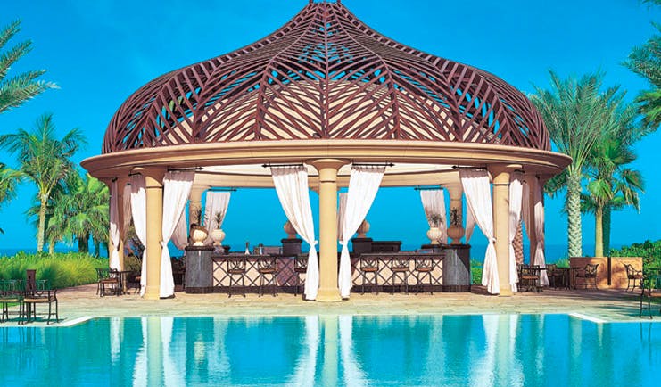 One and Only Royal Mirage Dubai pool bar with pergola and bar area