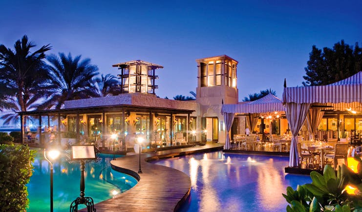One and Only Royal Mirage Dubai pool with walkway and covered seating areas