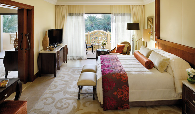 One and Only Royal Mirage Dubai superior executive bedroom with armchair television and balcony