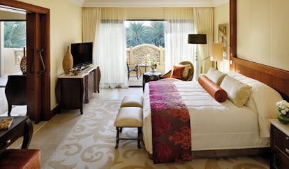One and Only Royal Mirage Dubai superior executive bedroom with armchair television and balcony