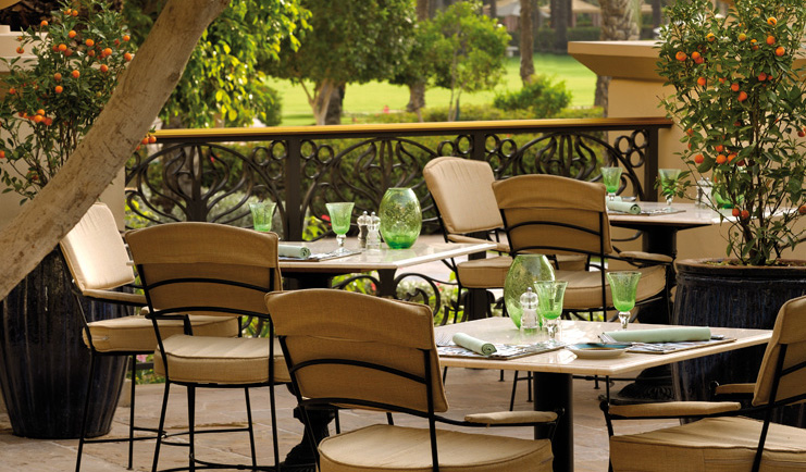 One and Only Royal Mirage Dubai terrace dining area with miniature orange trees