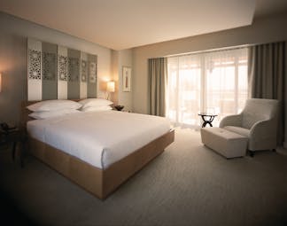 Park terrace suite with modern minimalistic decor, grey and white colour scheme and double bed