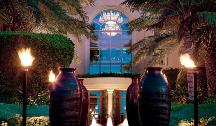 The Ritz-Carlton Dubai exterior view of lobby with urns and flaming torches