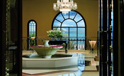 The Ritz-Carlton Dubai lobby view with fountain chandelier and sea view