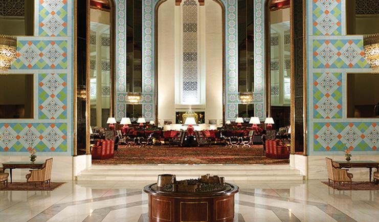 Al Bustan Palace Hotel Oman atrium with colourful wall tiles and seating area