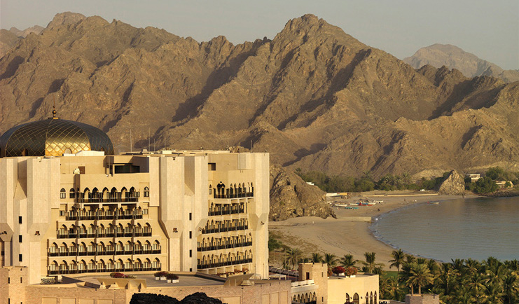 Al Bustan Palace Hotel Oman exterior view white building with domed roof and balconies