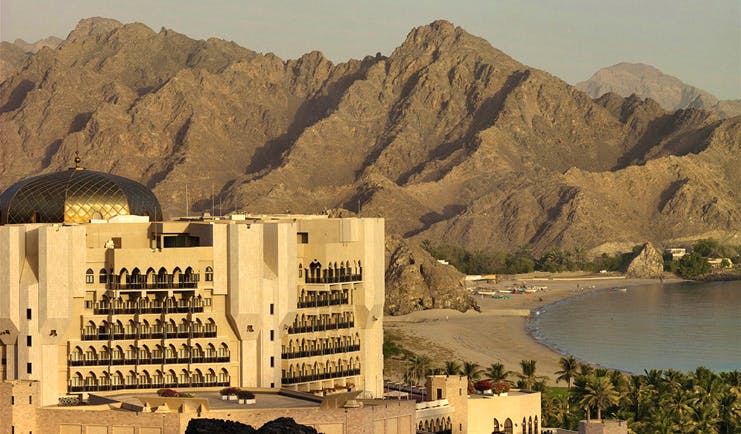 Al Bustan Palace Hotel Oman exterior view white building with domed roof and balconies