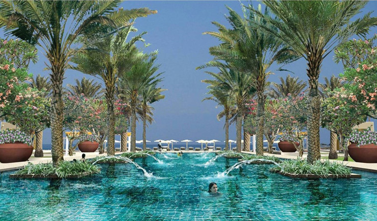 Al Bustan Palace Hotel Oman outdoor pool with palm trees and flowers