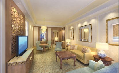 Al Bustan Palace Hotel Oman suite sitting room with sofa and armchairs