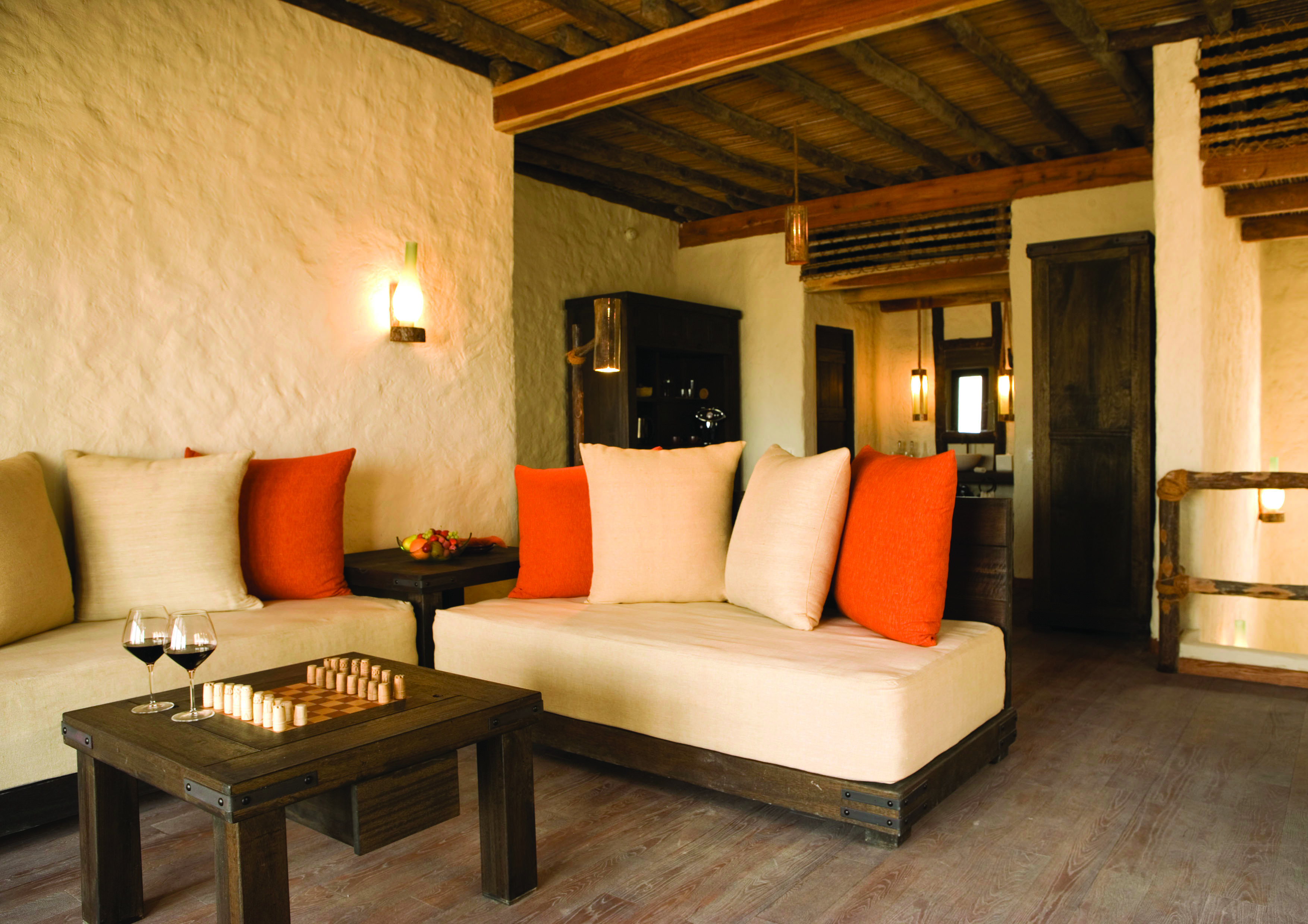 Six Senses Zighy Bay Oman lounge with sofa and table and chessboard
