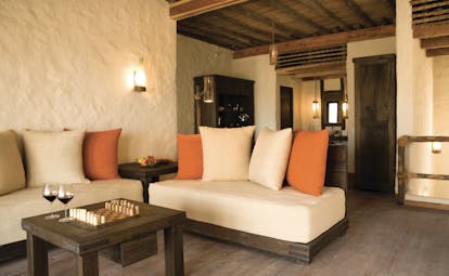 Six Senses Zighy Bay Oman lounge with sofa and table and chessboard