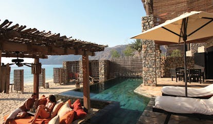 Six Senses Zighy Bay Oman pool villa exterior with covered deck and private beach