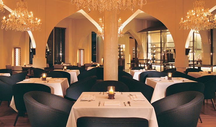 The Chedi Muscat Oman restaurant with chandeliers