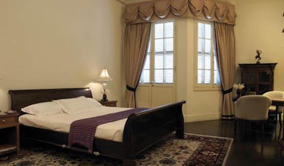 Raffles Hotel Le Royal Cambodia bed room classic decor sitting area drapes