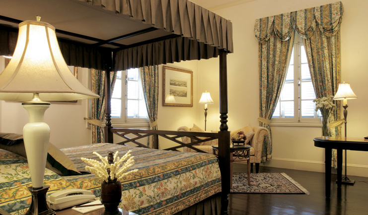 Raffles Hotel Le Royal Cambodia four poster traditional decor draped curtains