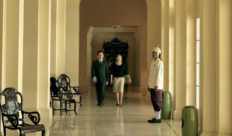 Raffles Hotel Le Royal Cambodia hallway couple staff member in formal uniform