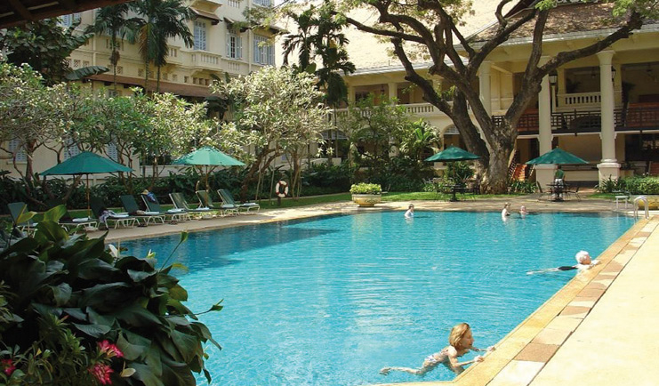 Raffles Hotel Le Royal Cambodia hotel pool courtyard gardens loungers