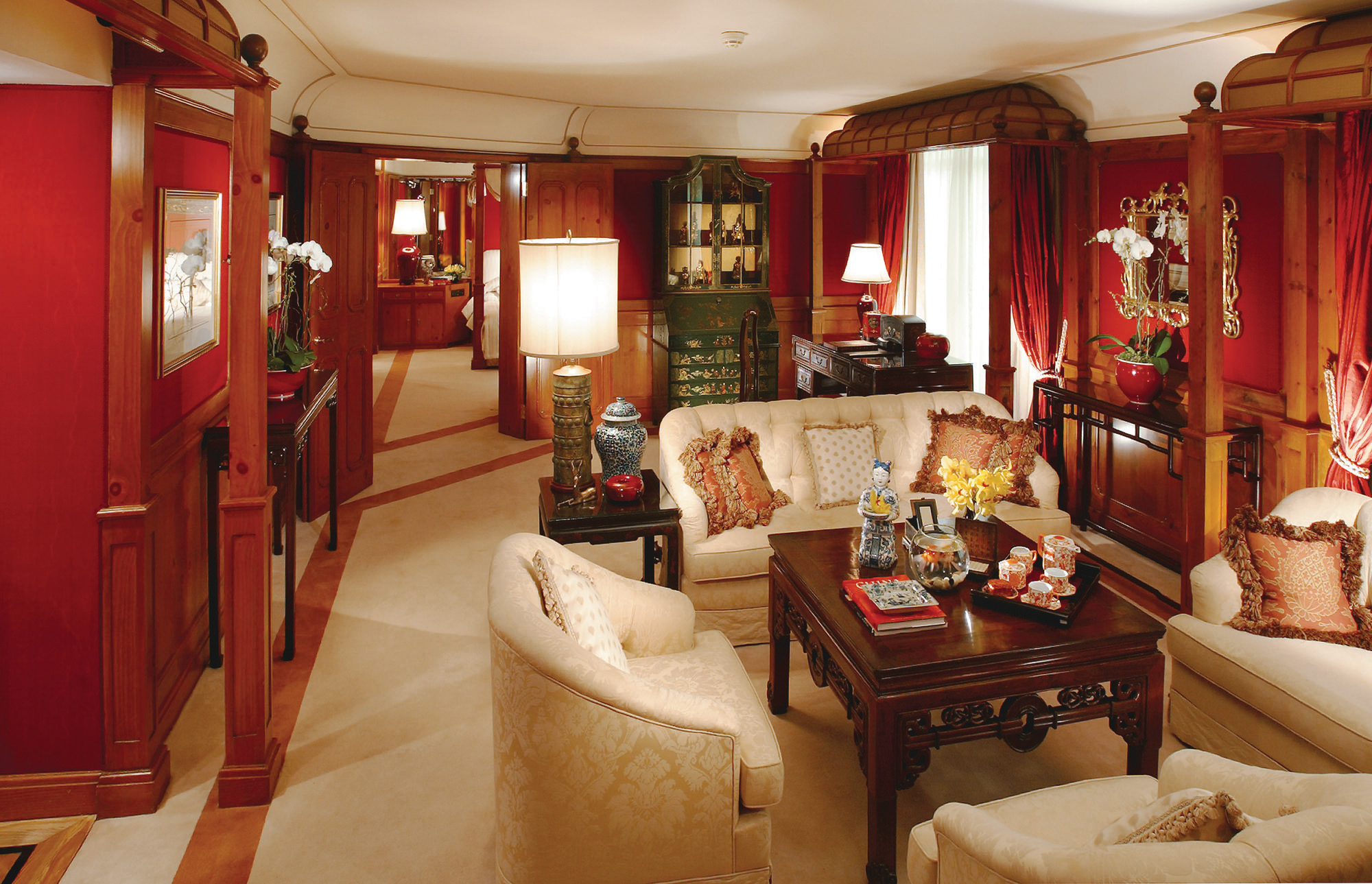 Mandarin Oriental suite with sofas, armchairs and wood pannelled walls