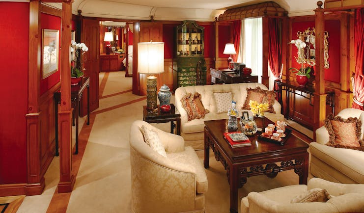 Mandarin Oriental suite with sofas, armchairs and wood pannelled walls
