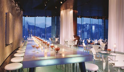 The Peninsula Hong Kong bar area modern decor long table seating area panoramic city view