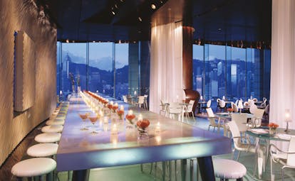 The Peninsula Hong Kong bar area modern decor long table seating area panoramic city view