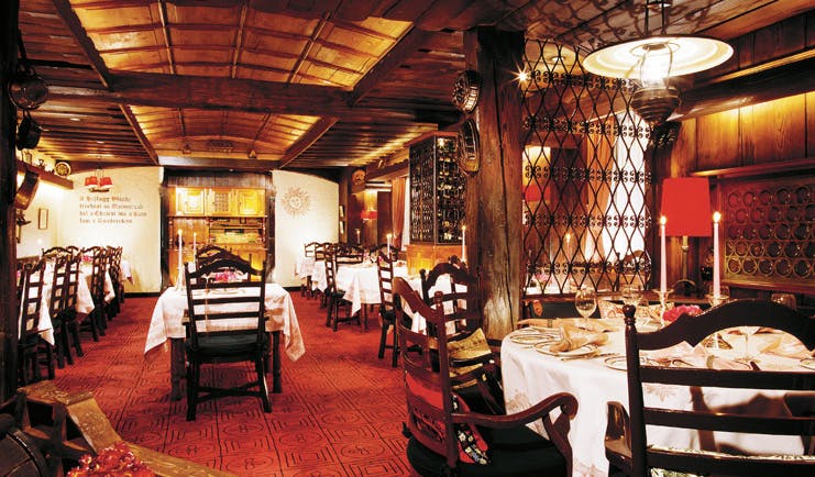 The Peninsula Hong Kong Chesa restaurant rustic decor exposed beams wine cabinet