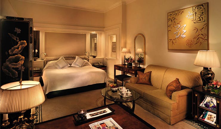 The Peninsula Hong Kong deluxe bedroom seating area coffee table with magazines