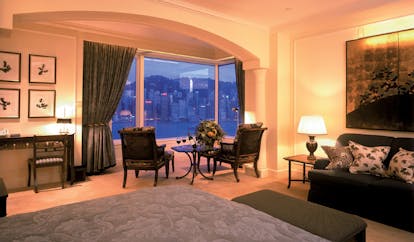 The Peninsula Hong Kong deluxe harbour view suite bedroom sofa dining area city and harbour view